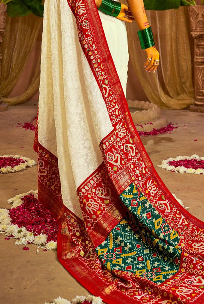 Traditional White & Red Patola Inspired Saree with Rich Woven Border