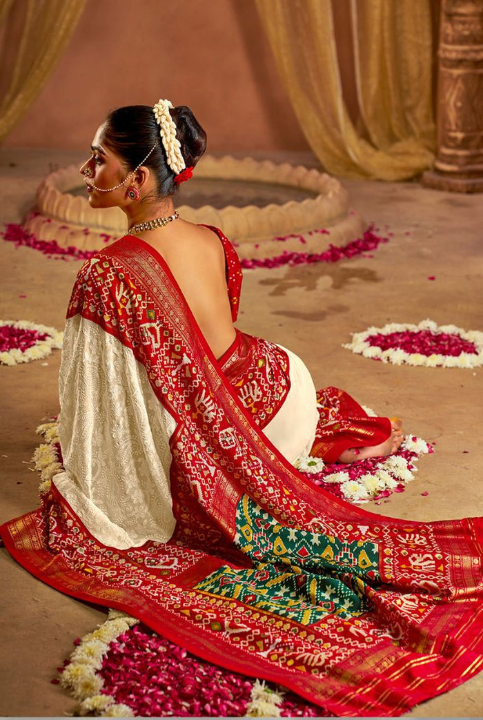 Traditional White & Red Patola Inspired Saree with Rich Woven Border